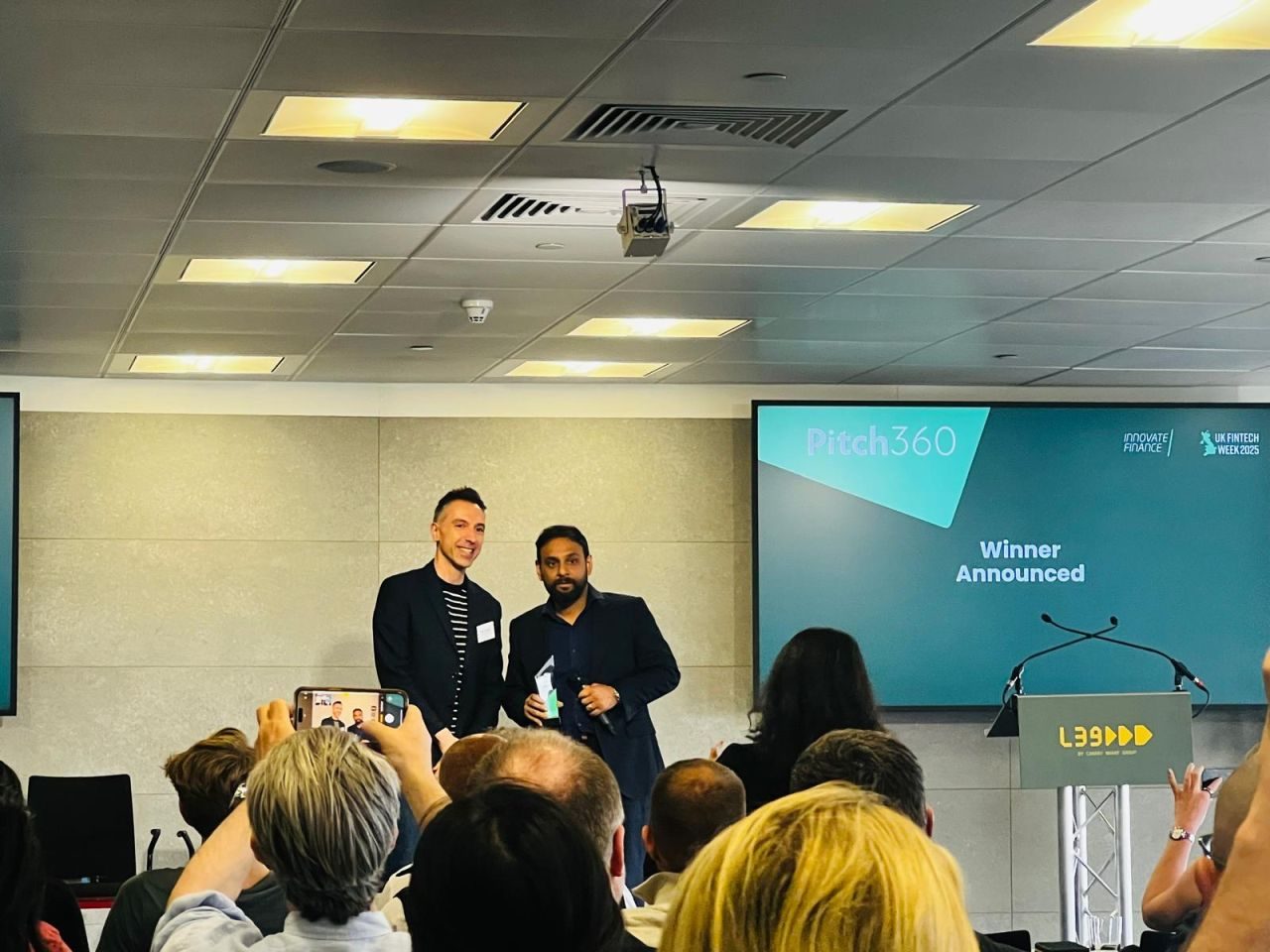 Asis Tewari, co-founder of nume, on stage receiving the Innovate Finance Pitch360 London award at UK FinTech Week 2025